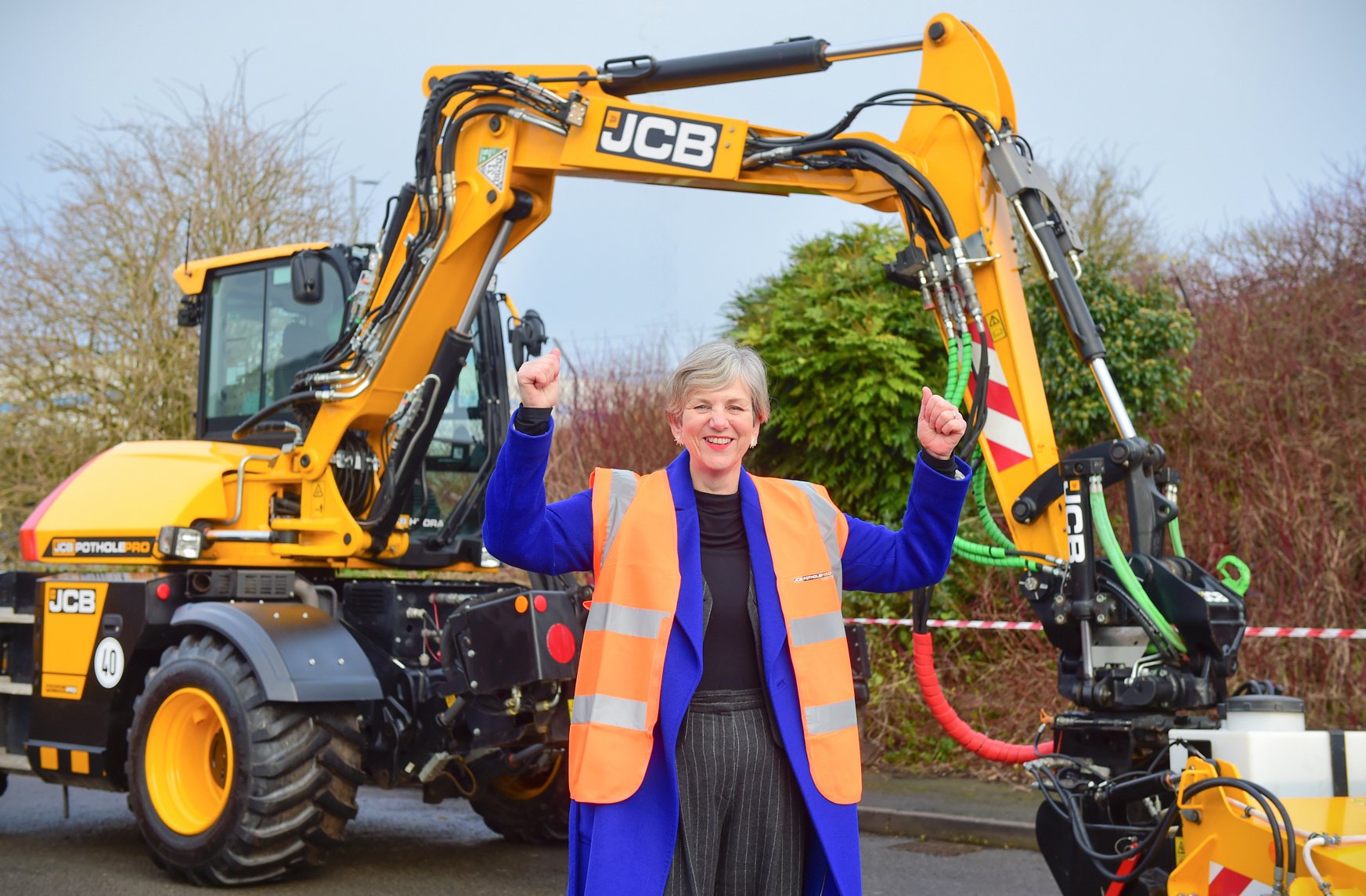 Roads Minister Lilian Greenwood with the JCB Pothole Pro-2